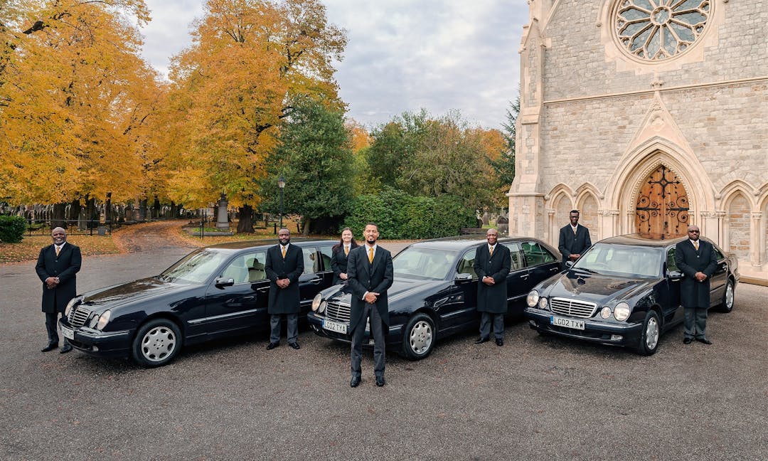 Hearse and Limousine with Pall Bearers